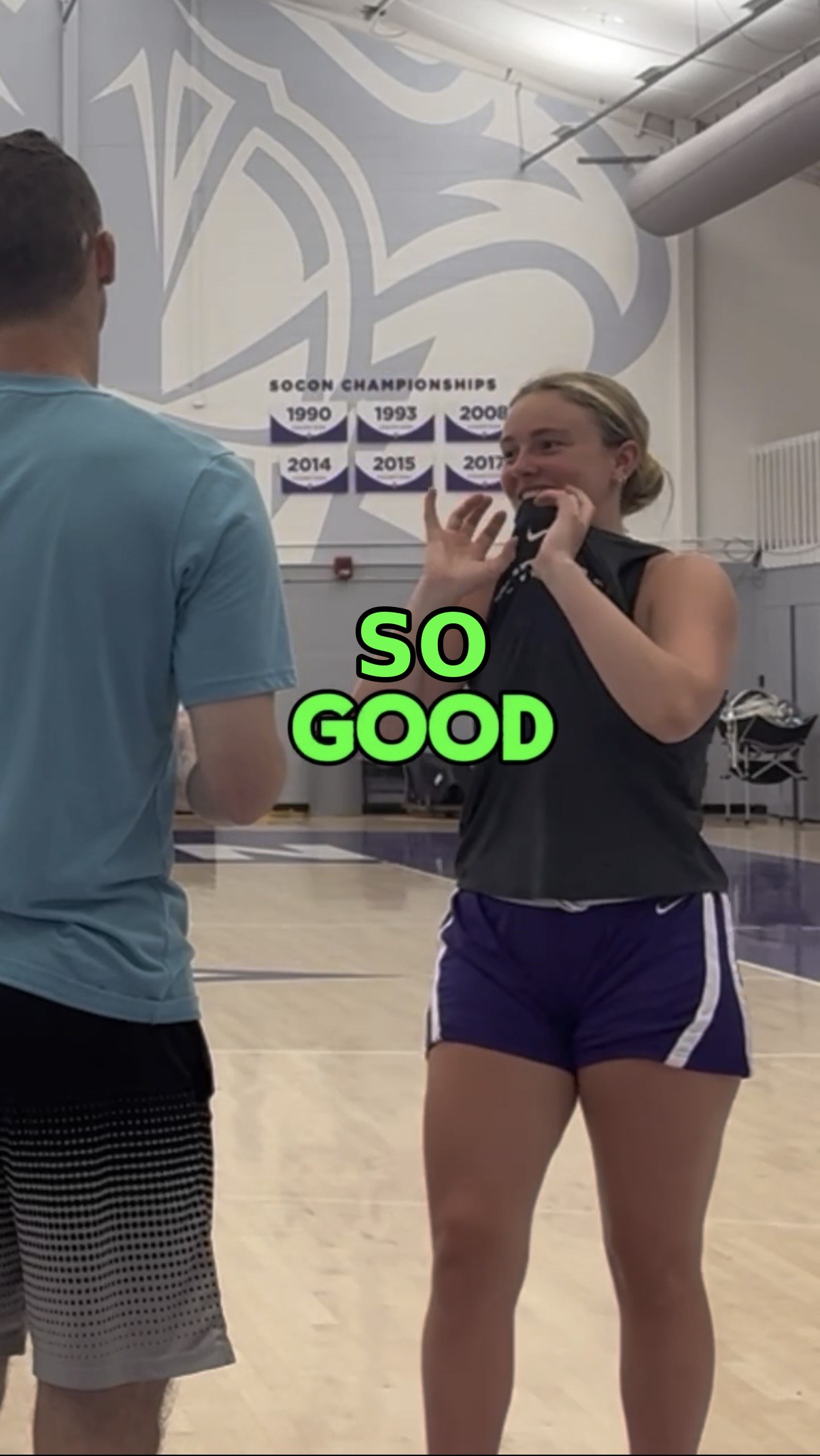 A college player reacting to how her shot feels in her first session