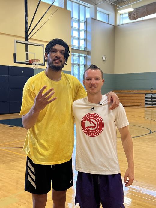 Bobby Perez working with Kaiser Gates in the gym