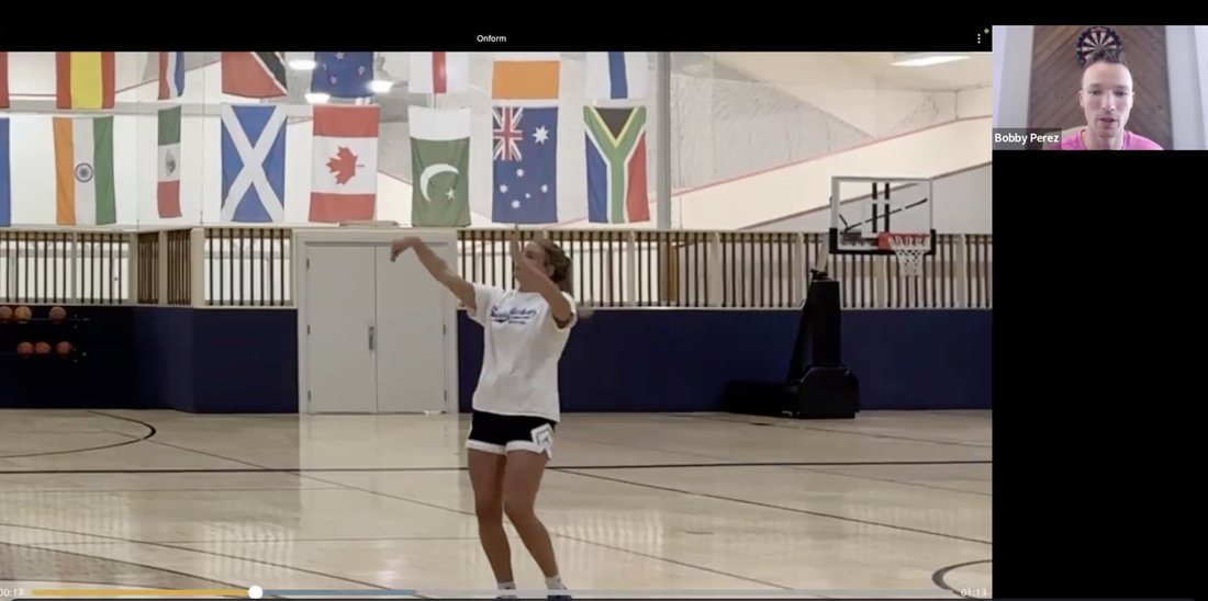 Screenshot of a live film review call: the coach on camera while a client's shot is paused at the follow-through in the film app