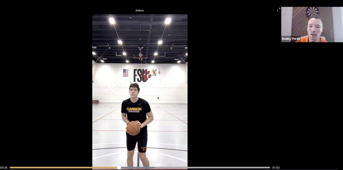 Live call screen share: a college guard's shot being reviewed frame by frame while the coach talks