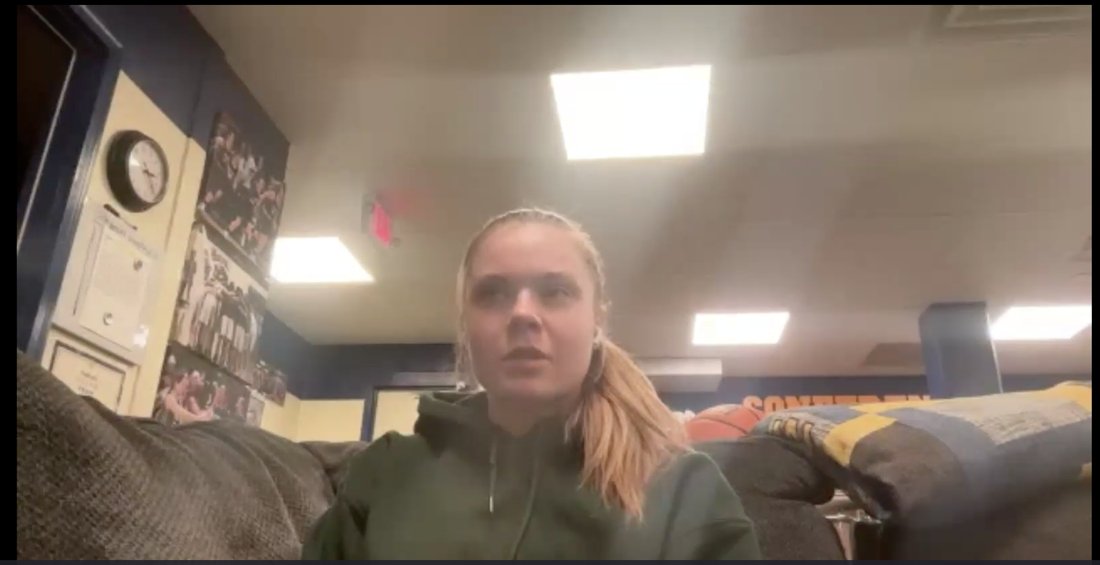A college player on a live call from her team lounge